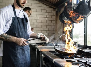 Chef cooking food in the restaurant kitchen